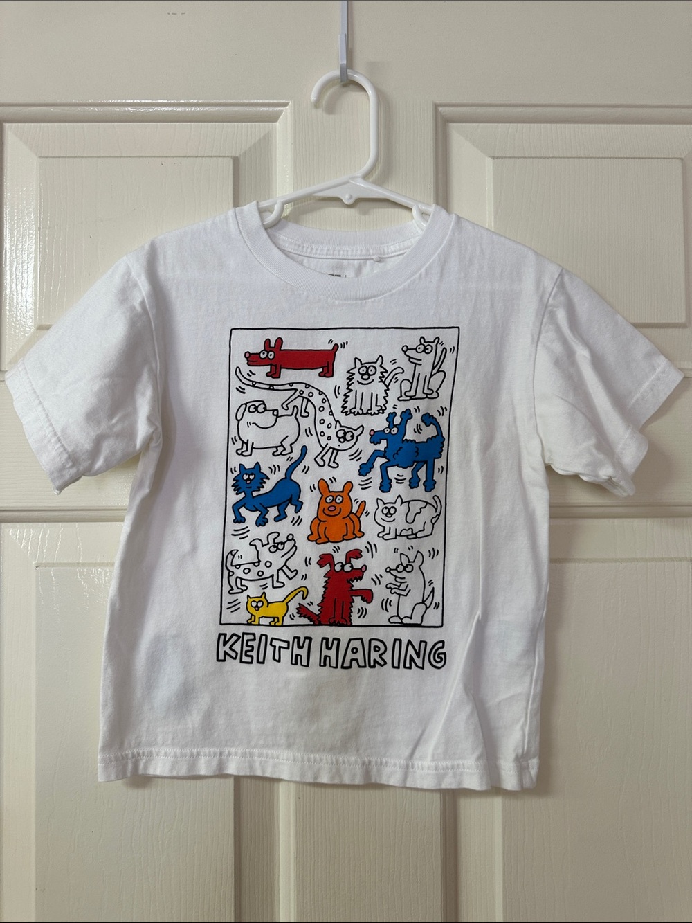 Uniqlo White Kids Keith Haring Graphic Tee with Red, Blue, Orange Accents